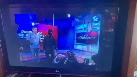 Ecuador TV studio taken over live on air by masked people brandishing guns